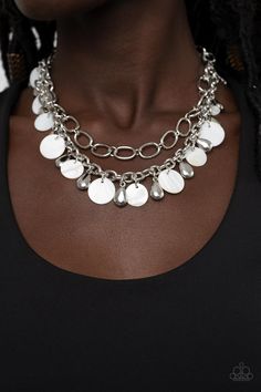 A pair of mismatched chunky silver chains layer below the collar. Shiny silver teardrop beads and white shell-like discs dance from the bottom of the lowermost chain, creating a tropical inspired fringe. Features an adjustable clasp closure.

Sold as one individual necklace. Includes one pair of matching earrings. Happy Jewelry, Silver Chains, Teardrop Beads, Paparazzi Accessories, White Necklace, Paparazzi Jewelry, Stylish Jewelry, White Beads, Shiny Silver