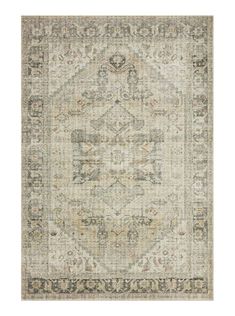 an area rug with various colors and patterns on the floor, including greys, beiges