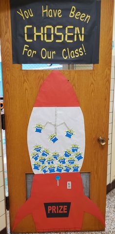 a door decorated to look like a rocket ship with the words, you have been chosen for our class