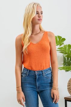 Our Lightweight Sweater Tank is the perfect staple piece for your wardrobe, providing a lightweight and versatile option for both summer and year-round wear. Also available in other colors. Lightweight, knit tank top Fits true to size 55% acrylic, 45% nylon Machine wash gentle cycle, hang dry Orange V-neck Knit Top, Summer Textured Knit Tank Top For Layering, Casual Textured Knit Sweater Vest For Spring, Trendy Textured Knit Sweater Vest For Summer, Summer Textured Knit Stretch Sweater Vest, Orange Seamless Sleeveless Tank Top, Seamless Orange Sleeveless Tank Top, Seamless Sleeveless Orange Tank Top, Casual Textured Knit Stretch Sweater Vest