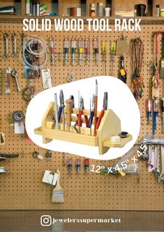 a peg board with many tools on it and the words sold wood tool rack above it