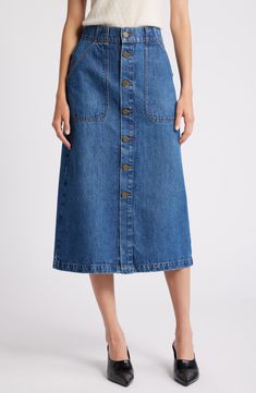 Exposed front buttons and angled patch pockets bring retro appeal to this midi skirt cut from soft denim in the perfect indigo wash. 32" length (size 29) Front button closure Front patch pockets; back patch pockets Unlined 80% regenerative cotton, 20% recycled cotton Machine wash, dry flat Imported Classic Straight Leg Denim Skirt With Pockets, Classic Denim Blue Denim Skirt With Pockets, Cotton Midi Denim Skirt With Pockets, Classic Dark Wash Denim Skirt With Pockets, Casual Midi Denim Skirt With Pockets, Casual Midi Length Denim Skirt With Pockets, Midi Length Denim Skirt, Denim Blue Straight-leg Denim Skirt With Button Closure, Utility Style Medium Wash Denim Skirt