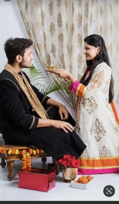 a man and woman sitting next to each other