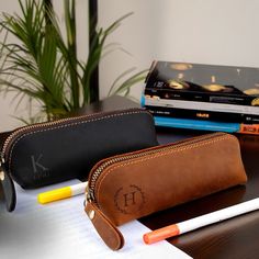 Discover the perfect blend of style, functionality, and craftsmanship with our bespoke leather pencil roll cases. Designed for artists, designers, and stationery enthusiasts who value both elegance and practicality, these custom-made cases are the ultimate solution for storing and organizing your precious pencils and drawing tools. Crafted from premium, full-grain leather, each pencil roll case is meticulously handmade by skilled artisans who take pride in their work. The supple, durable leather Classic Pencil Case With Pen Slots, Leather Pencil Case Pouch For Personal Use, Classic Leather Pencil Case For Personal Use, Classic Pencil Case For Daily Use, Leather Pencil Case With Pen Slots For Travel, Classic Pencil Case With Pen Holders, Classic Pencil Case With Pen Slots For Daily Use, Classic Rectangular Pencil Case For Personal Use, Leather Pencil Case With Card Slots For Personal Use