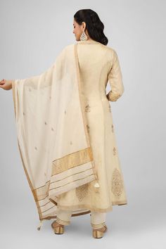 Ivory long jacket with floral embroidery using zari and sequins. Paired with an inner anarkali and pant. Comes along with a dupatta. - Aza Fashions Designer Raw Silk Dupatta In Cream, Designer Beige Dupatta With Traditional Drape, Designer Raw Silk Cream Dupatta, Designer Cream Raw Silk Dupatta, Off White Anarkali Salwar Kameez In Raw Silk, Cream Salwar Kameez With Dupatta In Traditional Drape, Designer Off-white Anarkali Set With Intricate Embroidery, Cream Chanderi Traditional Wear With Embroidered Border, Off White Raw Silk Anarkali Dupatta