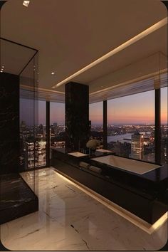 a bathroom with large windows overlooking the city