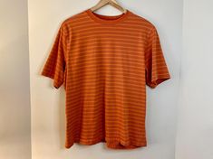 This is a 90s / Y2K era orange striped skater style t-shirt made by Penman's. 100% cotton material. It is a US Mens Size L. In good vintage condition - please review all photos for details! Approx. measurements laying flat: ~25 inch length ~23 inches pit to pit ~9 inch sleeve ⊹ Bundle Discounts ⊹ Buy 2 items and save 20% with code: BUY2SAVE20 Buy 3 or more items and save 30% with code BUY3SAVE30 90s Striped Crew Neck Top, 90s Striped Short Sleeve T-shirt, Striped 90s Style T-shirt For Summer, 90s Striped T-shirt For Summer, Striped 90s Style Summer T-shirt, Retro Striped T-shirt For Streetwear, 90s Striped Cotton T-shirt, Y2k Era, Orange Shirt