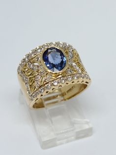 LeVian 18K Yellow Gold, Natural Diamond & Sapphire Ring Size 6.25 Beautiful 18K Yellow Gold LeVian ring with a 1.40 carat oval Sapphire in the center and 48 round diamonds on the side for a total diamond weight of 0.50 carats, H/I color and VS/SI clarity Pre-owned and polished for a showroom finish, total ring weight is 9.12 Grams Includes GAL Appraisal MSRP $6,850 Free ring sizing included, must include ring size with purchase order Shipped Free with USPS Priority Mail Levian Rings, Celebrity Engagement Rings, Future Engagement Rings, Sapphire Diamond Ring, Sapphire Ring, Round Diamonds, Natural Diamonds, Sapphire, Ring Size