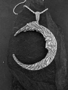 "I hand cast all my pieces using the lost wax casting method. This Moon Pendant is Sterling Silver, The included chain is a Sterling Silver Rope chain. You may chose 16, 18 or 20 inch at the same price. Other length available at sightly higher prices. Please ask your needs. This Moon measures 3 5/8\" tall by 2 1/2\" across. You may call me with questions, often I am out so please use my machine. 831-476-3176. Satisfaction Guaranteed I send items USPS First Class unless otherwise directed. I send Hand Forged Sterling Silver Crescent Jewelry, Artisan Crescent Jewelry Hand Forged, Artisan Hand Forged Crescent Jewelry, Artisan Hand-forged Crescent Jewelry, Silver Crescent Jewelry With Oxidized Finish, Symbolic Hand-cast Jewelry, Hand Forged Sterling Silver Moon Jewelry, Silver Engraved Moon-shaped Jewelry, Hand Forged Moon Shaped Sterling Silver Jewelry