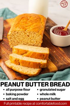 a loaf of bread sitting on top of a wooden cutting board next to a bottle of peanut butter