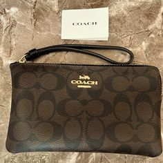 This Cute, Practical Brown Coach Logo Print Wristlet (Has 2 Card Slots) Is The Perfect No-Nonsense Accessory For That Woman-On-The Go! Quite Roomy!! Measurements: Length (Top To Bottom): 4.5" Width: Across: 7.5" Thanks For Checking Out This Listing! Happy Shopping!! Coach Clutch Wristlet With Removable Pouch, Coach Pouch Clutch With Zipper, Coach Zipper Pouch Wristlet, Coach Wristlet With Zipper Pouch, Coach Zipper Wristlet, Coach Clutch Wallet, Coach Clutch With Wrist Strap, Coach Rectangular Clutch With Wrist Strap, Wallet Aesthetic