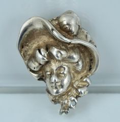 "A substantial Art Nouveau pin. This lovely pin features a figural image of a woman wearing a large hat and is crafted from solid sterling silver. The pin is clearly hallmarked \"STERLING\" and weighs an impressive 14.5 grams. It measures 1 1/4 inches top to bottom by 1 inch at the widest point. The pin is in excellent vintage condition and ready to wear! Always open to offers! Please ask any questions and free shipping anywhere in the USA!" Sterling Silver Hallmarked Brooches, Woman Profile, Large Hat, Flat Stone, Large Hats, Female Profile, Brooch Vintage, Pretty Rings, Vintage Crystal