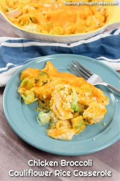 chicken broccoli cauliflower rice casserole on a blue plate with a fork