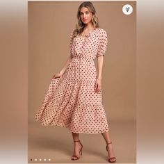 Nowt Blush Pink Polka Dot Tiered Midi Dress! Textured Woven Fabric, Covered In Brown Polka Dots, Shapes This Classy And Timeless Dress With A Ruffle-Trimmed Rounded Neckline, With A Tying Detail And Front Cutout, That Falls To A Button-Front Bodice, Framed By Short Puff Sleeves (With Elasticized Cuffs). Elasticized Waist Tops A Tiered Midi Skirt With A Flouncy Hem. Fully Lined. Self: 100% Polyester. Lining: 100% Polyester. Hand Wash Cold. No Holes, Stains Or Tears. Fast Shipper Smoke Free Feel F Polka Dot Swiss Dot Midi Dress, Flowy Polka Dot Midi Dress, Casual Midi Length Dresses With Swiss Dot, Casual Swiss Dot Midi Length Dresses, Casual Midi Length Swiss Dot Dresses, Casual Swiss Dot Midi Dress, Feminine Polka Dot Dress For Brunch, Flowy Polka Dot Dress For Brunch, Spring Midi-length Swiss Dot Maxi Dress