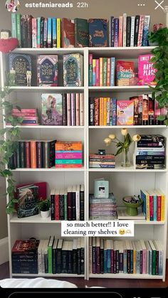 a white book shelf filled with lots of books