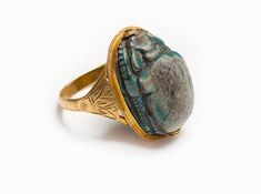 Antique Egyptian Revival Gold Papyrus Scarab Ring Ancient Intaglio Ring Jewelry, Carved Ring Fine Jewelry, Fine Jewelry Carved Ring, Ceremonial Multi-stone Jewelry Ring, Ceremonial Multi-stone Ring Jewelry, Ancient Style Carved Rings Gift, Ceremonial Oval Cabochon Rings, Ancient Oval Rings For Gift, Ancient Oval Rings As A Gift