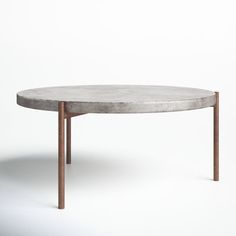 a concrete table with wooden legs on a white background