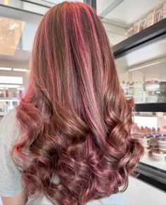 Brown Hair With Pink Stripes, Brown Hair With Red Highlights Curly, Pink On Brunette Hair, Brown Hair With Fun Colors, Chocolate Pink Hair, Brown With Pink Underneath, Curly Pink Highlights, Red Highlights On Light Brown Hair, Pink Calico Hair