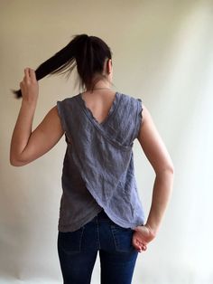 "This linen top is perfect for the hot summer days. Made from wonderfully textured and high quality European linen. It features a pinafore cut and frayed edges. Linen being highly absorbent fabric, the top will allow your body to breathe and feel at ease. And the more you wear and wash it the more it will gain in its character and softness. Choose from multiple linen fabrics available. The top will be custom made for you within 10 days with great attention to finishing. You will receive the top Summer Tank Top Vest, Cotton Vest Top For Vacation, Summer Sleeveless Cotton Tops, Casual Linen Vest Top, Summer Sleeveless Blouse With Relaxed Fit, Summer Sleeveless Relaxed Fit Blouse, Cotton Sleeveless Blouse For Summer, Relaxed Fit Sleeveless Blouse For Summer, Summer Sleeveless Relaxed Fit Top