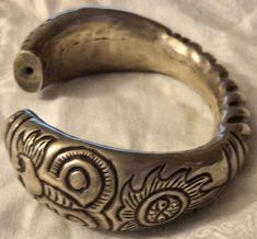 "Superb late 19th century Chinese silver cuff or wedding bracelet, silver, probably sterling or a lesser grade, not plated, hollow construction, circa 1890s, w lion motifs on the end. Nice weight and authentic period piece. The bracelet has an inside measurement of about 2 5/8\" across with a 1\" opening to easily wear and/or remove. It would fit a medium to large wrist. If you shake it you can hear a faint sound as if there is a teeny piece of metal inside. Total weight is approximately 45 gram Antique Silver Engraved Cuff Bracelet, Engraved Antique Silver Cuff Bracelet, Antique Silver Etched Cuff Bangle, Ornate Silver Cuff Bracelet For Festivals, Hallmarked Antique Silver Cuff Bangle Bracelet, Antique Hallmarked Cuff Bracelet For Ceremonial Use, Ceremonial Silver Etched Bangle, Antique Etched Bangle Cuff Bracelet, Antique Etched Cuff Bracelet