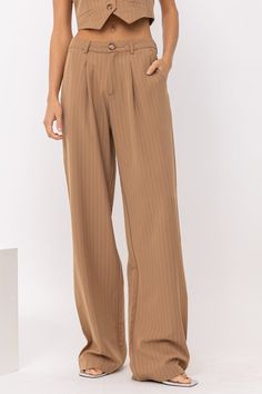 Get ready to slay the fashion game in our Penny trousers! These pleat waist pinstripe pants are the perfect netural bottom to add to our capsule wardrobe and elevate your look. Tailored with ease makes these the perfect pant to take from season to season and style limitless ways. But don't forget to grab the Penny Pinstripe Vest for the full co-ord look we are LOVING! Woven with Some Stretch Pinstripe Please Front Functional Pockets Relaxed Trouser 80% Polyester 14% Cotton 6% Spandex Pinstripe Vest, Going Out Looks, Relaxed Trousers, Pinstripe Pants, Perfect Pant, Corsets And Bustiers, Denim Details, Dress Romper, Co Ord