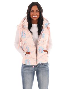 Get ready for blooming style with the Garden Grove Floral Puffer Vest! This cozy vest features a playful floral print, a convenient hoodie, and a zipper closure for easy wear. Perfect for layering and adding a touch of quirkiness to any outfit. Trucker Hat Fashion, Cozy Vest, Gameday Dress, Garden Grove, Outerwear Vest, Vest White, Cardigan Vest, Puffer Vest, Cardigan Jacket