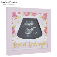 a baby's photo frame with the words love at first sight