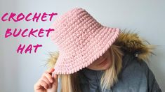 a woman wearing a pink crochet bucket hat with the words crochet bucket hat