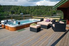 a hot tub sitting on top of a wooden deck