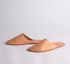 A simple, chic take on the classic house slipper. FROM THE MAKER: It’s so important to take care of your feet. We suggest you put them in these stylish house shoes in a slip on silhouette, made with a double layer vachetta sole and vegetable tanned leather upper. Sizing ﻿XS: 6-7 W, 36-37 Euro S: 8-9 W, 38-39 Euro M: 10-11 W, 8-9 M, 40-41 Euro Location Gifts, Pointy Shoes, Electronic Gifts, Leather Slippers, Simple Chic, House Shoes, Classic House, House Slippers, Monogram Initials