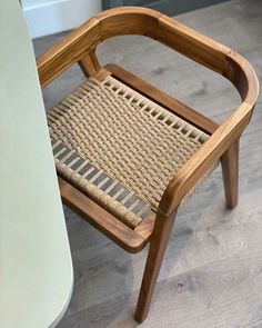 a wooden chair sitting on top of a hard wood floor