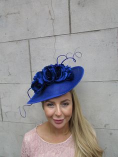 This hat is perfect for special occasions. Featuring royal blue artificial flowers and striking statement feathera on a royal blue base. Mounted on a thin royal blue headband. The base measures 30cm across at it's widest point. Perfect for races, weddings and special occasions! Made in the UK -   .   Many more items like this are available in our shop! Made in the UK - custom orders are welcome Blue Artificial Flowers, Blue Rose Flower, Special Occasion Hats, Baby Blue Weddings, Blue Headband, Flower Fascinator, Feather Wedding, Wedding Fascinators, Kentucky Derby Hat