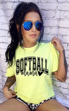 Softball Shirt AT CHECKOUT: ▪️ Shirt Color(Shown in Lemon) ▪️ Size ▪️ Design Color SHIRT INFO: ▪️ Comfort Color heavy blend shirts ▪️ All shirts are unisex fit. Please refer to the size chart provided in the listing photos for more details. ▪️ Unisex, 6.1 oz, 100% ring spun cotton, garment-dyed, DESIGN INFO: ▪️ Design is heat transfer vinyl and is applied to each shirt with a commercial grade heat press. ▪️ There may at times be a slight difference between real and perceived colors of an item du Softball Outfits Women, Yellow Tops With Screen Print For Sports, Yellow Tops With Letter Print For Sports Season, Yellow Sporty Shirt For Sports, Sporty Yellow Shirt For Sports, Yellow Tops With Sublimation Print For Sports Events, Black Sports Tops With Heat Transfer Vinyl, Sporty Green Shirt With Letter Print, Sporty Green Shirt For Sports Events