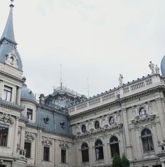 an old building with a clock tower on top