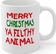 a white coffee mug with merry christmas ya filthy animal on it