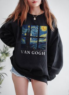 "This is the Van Gogh Starry Night Crewneck Sweatshirt. The soft, warm material is made from a blend of cotton and polyester. It has no itchy side seems and a trendy, loose fit. The cool design on this aesthetic crewneck features Van Gogh's painting, \"The Starry Night,\" in a unique collage. PLEASE SIZE UP 2-3 SIZES FOR A TRENDY, LOOSE FIT! If you like this design but would prefer it on a back print, check out this listing here: https://www.etsy.com/listing/1249707034/van-gogh-sweater-van-gogh- Artistic Oversized Long Sleeve Sweatshirt, Artistic Long Sleeve Cotton Sweatshirt, Artistic Relaxed Fit Sweatshirt For Fall, Oversized Graphic Print Aesthetic Sweatshirt, Aesthetic Crew Neck Sweatshirt With Graphic Print, Artistic Graphic Print Sweatshirt For Fall, Oversized Aesthetic Sweatshirt With Graphic Print, Crew Neck Sweatshirt With Graphic Print, Artistic Crew Neck Sweatshirt With Letter Print