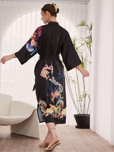 The Dragon Phoenix Kimono Robe is designed for those who appreciate the finer things, allowing you to feel elegant and empowered, no matter the occasion. With its exquisite craftsmanship and timeless appeal, it makes a thoughtful and memorable present for a loved one. • Silky Comfort: Made of high-quality polyester charmeuse, our robes are soft, lightweight and cooling for summer. They have a smooth and breathable texture that feels just like natural silk. • One size fits most: With a chest and Phoenix Female, Luxury Long Silk Kimono, Shower Robes, Elegant Embroidered Silk Kimono, Luxury Traditional Printed Kimono, Chinese Silk Robe Dragon, Long Silk Embroidered Kimono, Silk Bathrobe, Dragon Phoenix