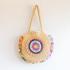 In stock fast shipping from Los Angeles! The Elena Handbags Boho Round Beach Straw Tote is the perfect accessory to elevate your summer style. Handcrafted with eco-friendly woven straw, this stunning boho shoulder bag is sure to make a statement whether you're beach-going, yoga-practicing or running everyday errands. Carry your essentials in style with this chic and sustainable tote. Zipper closureFully linedInside pocketStrap drop: 11 inchesSize: 17.5 in diameter Designer Style ID: 8627 Boho Round Beach Woven Bag, Handmade Straw Woven Shoulder Bag, Summer Beach Bag Summer Multicolor Jute Shoulder Bag, Multicolor Jute Shoulder Bag For Summer, Bohemian Bags With Adjustable Strap For Beach Season, Multicolor Jute Shoulder Bag For Beach, Bohemian Beach Bag For Beach Season Travel, Bohemian Beach Bag For Travel And Beach Season, Bohemian Beach Bag For Travel During Beach Season, Bohemian Straw Tote Bag For Vacation, Bohemian Straw Shoulder Bag For Travel