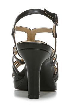 A glittery sandal showcases evening-ready appeal with a tapered heel and strappy vamp. 3 1/4" heel Synthetic upper, lining and sole Imported Black Strappy T-strap Sandals With Adjustable Strap, Black T-strap Slingback Sandals With Adjustable Strap, Glittery Sandals, Cheap Black Synthetic T-strap Sandals, Black Strappy Sandals With 4-inch Heel, Black T-strap Synthetic Sandals, Wide Width Sandals, Slingback Sandal, Nordstrom Rack