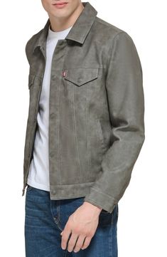 Bring a bit of rock 'n' roll to your day-to-day with this classic trucker jacket updated with a sleek faux-leather fabrication. 25 1/2" length (size medium) Spread collar Button cuffs Lined 100% polyurethane Machine wash, tumble dry Imported Casual Biker Jacket With Flap Pockets For Fall, Casual Fitted Leather Jacket With Flap Pockets, Casual Biker Jacket With Snap Buttons For Fall, Casual Leather Jacket With Flap Pockets For Spring, Casual Levi's Leather Jacket, Levi's Casual Leather Jacket For Fall, Casual Leather Jacket With Flap Pockets, Casual Collared Leather Jacket With Faux Pockets, Casual Biker Jacket With Faux Front Pockets For Spring