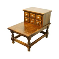 a small wooden table with drawers on it's top and bottom drawered open