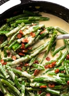 green beans with bacon and cream sauce in a skillet