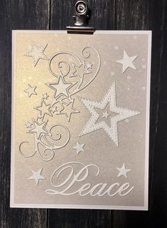 a card with stars and the words peace on it