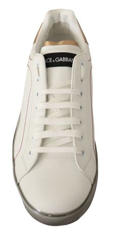 Step into style with these stunning, brand new low-top sneakers from the iconic Dolce & Gabbana collection. Featuring classic lacing, a crisp white sole, and chic gold logo detailing, these sneakers are perfect for adding a touch of luxury to any outfit. Crafted in Italy, they boast a 100% leather construction, ensuring both quality and comfort. Make a statement with every step. Material: 100% Leather Color: White Rubber sole with logo details Country of origin: Italy Formal Loafers, Dolce E Gabbana, Low Top Sneakers, Gold Logo, Fashion Website, Gold Leather, Dolce & Gabbana, Casual Boots, Gold Material