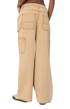 A vintage-inspired take on the utility trend, these distressed nonstretch carpenter jeans feature a low-rise waist, full-length wide legs and a paneled design. Zip fly with button closure Five-pocket style; tool pockets; hammer loop 100% cotton Machine wash, dry flat Imported Beige Cargo Jeans For Fall, Fall Beige Cargo Jeans, Beige Utility Cargo Jeans, Distressed Utility Cargo Jeans For Spring, Mid-rise Washed Utility Jeans, Utility Mid-rise Washed Jeans, Beige Utility Cargo Jeans With Straight Leg, Utility Flare Jeans With Patch Pockets For Fall, Utility Beige Cargo Jeans For Streetwear