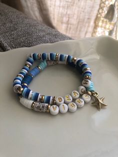 Ready for summer, this "Beach Vibes" bracelet set says it all!  Made with blue, white, and gray and tan speckled clay beads, gold plastic beads, white and gold plastic letter beads, complete with a gold plastic starfish charm.  On a stretchy elastic cord, this set fits most! Beach Bracelet, Bracelets Clay Beads, Fun And Easy Diys, Moon Bracelet, Polymer Clay Bracelet, Beach Bracelets, Clay Bracelet, Diy Bracelet Designs, Summer Bracelets