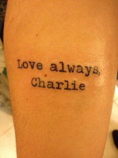 a person with a tattoo that says love always charlie on their arm and the words above it are written in cursive black ink