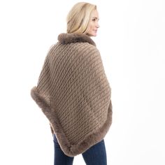 Elevate your cold-weather wardrobe with the Fur Trimmed Cozy Cable Poncho, a luxurious blend of warmth, style, and sophistication. This cable knit poncho is crafted from soft 100% polyester, offering a cozy feel while draping beautifully over your shoulders. The warm brown hue adds richness and depth, while the fancy faux fur trim along the neckline and edges brings an extra touch of elegance. Designed with the flexibility of a poncho, this piece is perfect for layering over your favorite outfit Cozy Brown Hooded Poncho, Cable Knit Poncho, One Size For Winter, Luxury Brown Poncho, Brown Poncho For Layering, One Size, Cozy Brown Alpaca Poncho, Cowl Neck Poncho, Poncho Jacket, Capes & Ponchos, Cozy Coats