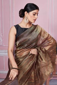 Alluring metallic brown tissue Banarasi saree is a perfect choice for festive occasions. It comes with a matching blouse piece. Disclaimer: The shown stitched blouse on the model is for display purpose only. The saree comes with a matching blouse piece and finished with fall and piko. Banarasi Sari, Latest Designer Sarees, Fashion Journals, Banarasi Saree, Traditional Fabric, Designer Sarees, Banarasi Sarees, Look Your Best, Blouse Dress