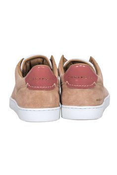 Step into playful style with Rubirosa's "Odile D" sneakers. Crafted with tan and white suede, these sneakers are perfect for casually adding a cozy touch to any outfit. Pair them with your favorite knit and jeans for a comfortable and chic look! Size 7 (IT 37) Made in Italy Suede and Leather Lace up front ties White rubber soles Toe to heel 10.125" Beige Suede Sneakers With Contrast Sole, Cream Suede Sneakers With Stitched Sole, Beige Suede Sneakers With Stitched Sole, Pink Suede Casual Sneakers, Casual Pink Suede Sneakers, Beige Sneakers With Suede Lining And Round Toe, Trendy Suede Sneakers With Rubber Sole, Trendy Beige Suede Sneakers, Casual Suede Sneakers With Rubber Sole